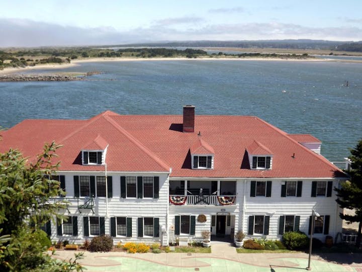 May contain: nature, outdoors, scenery, water, waterfront, architecture, building, and lakefront