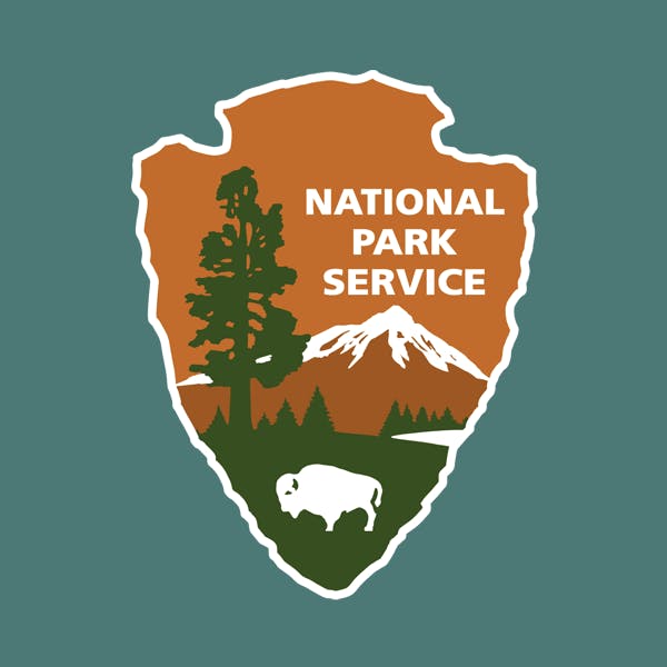 National Park Service Logo with Trees, Meadows, Mountains and Buffalo