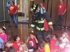kids with firefighters