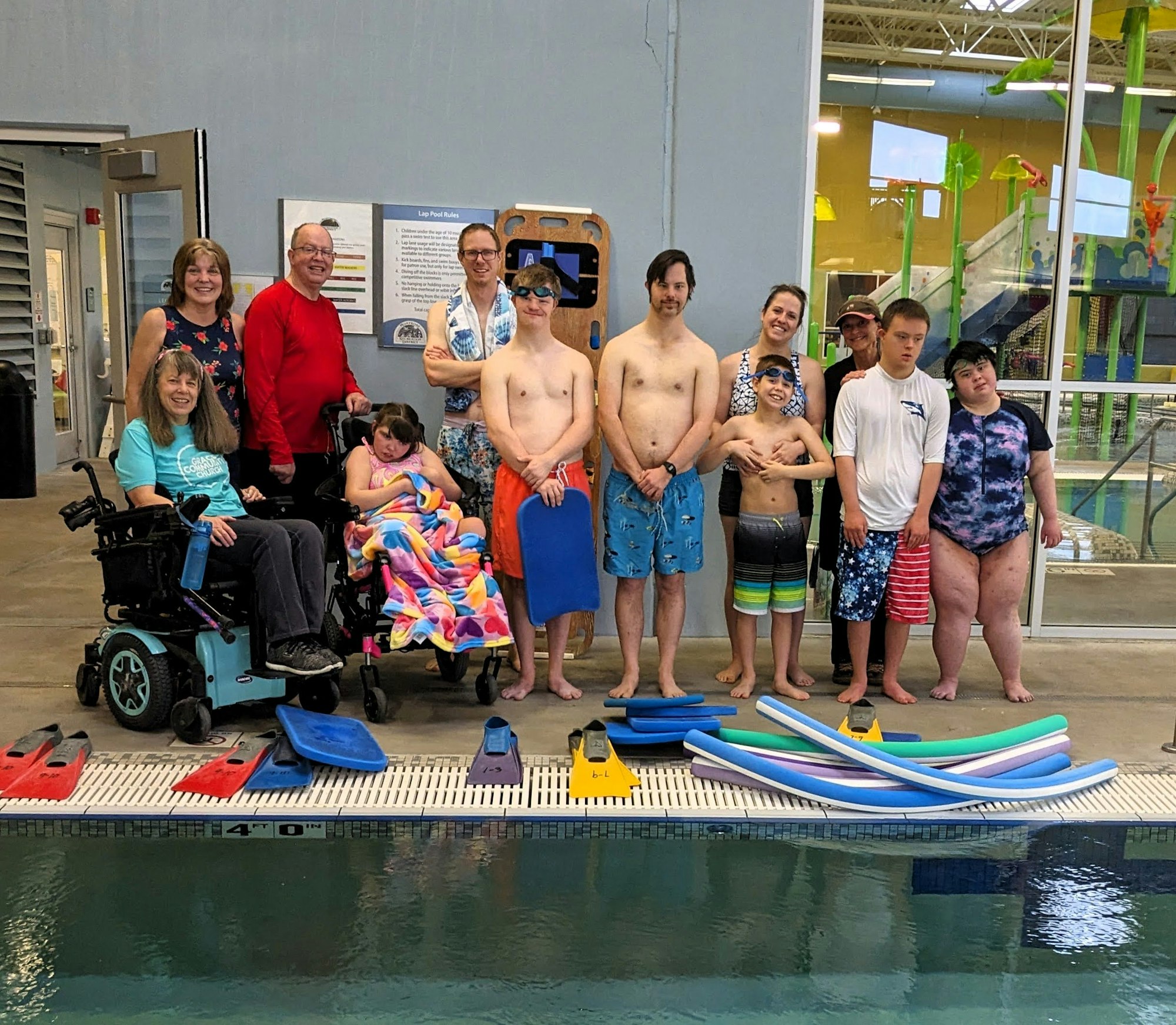 Members of MRD's Special Olympics Swim Team pose for a picture poolside