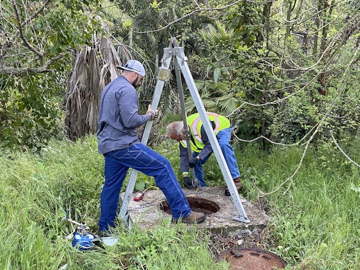 May contain: worker, person, glove, clothing, shoe, footwear, hat, man, adult, and male
