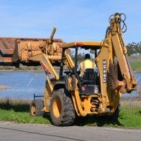 May contain: person, human, bulldozer, tractor, vehicle, and transportation