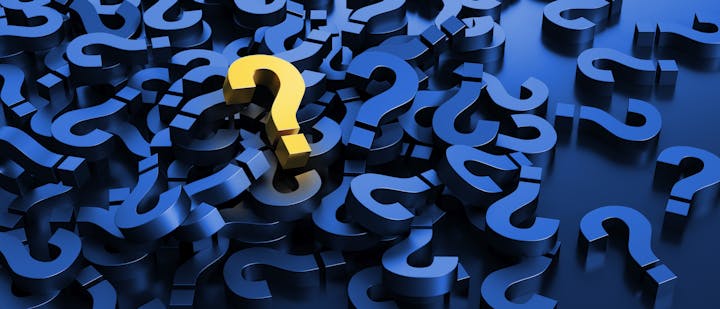 A cluster of blue question marks with a single yellow question mark in the center.