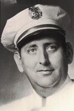 John Meehan, Jr. in a uniform wearing a cap with an emblem.