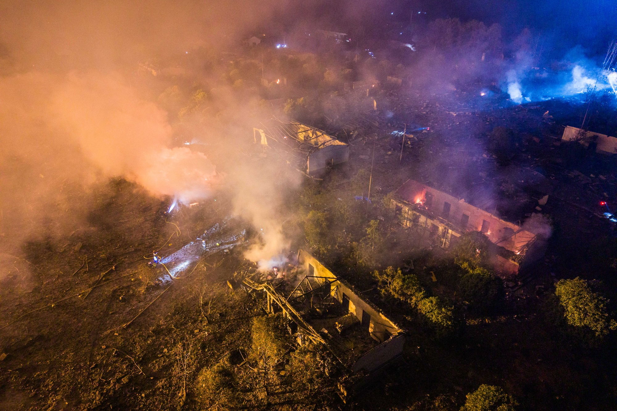 Aerial photo of several buildings that exploded and caught fire at the fireworks facility.