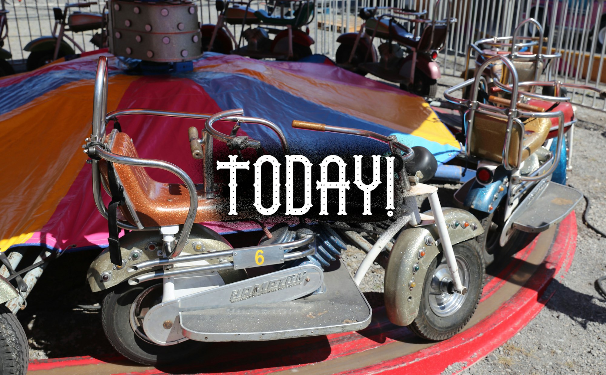 A carousel of colorful bumper cars with "TODAY!" superimposed on the photo.
