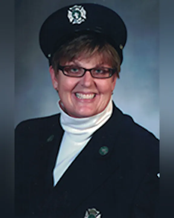 Wendy Czajak wearing a uniform and glasses, smiling.