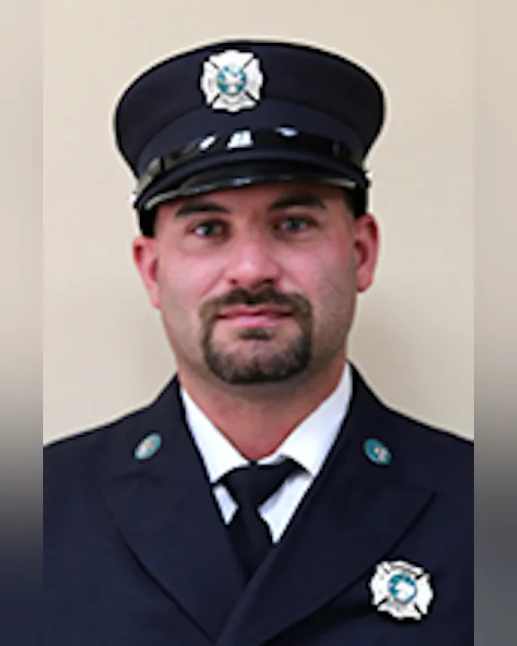 Zach Van Auken in his dress uniform, including cap