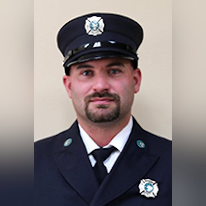 Zach Van Auken in his dress uniform, including cap