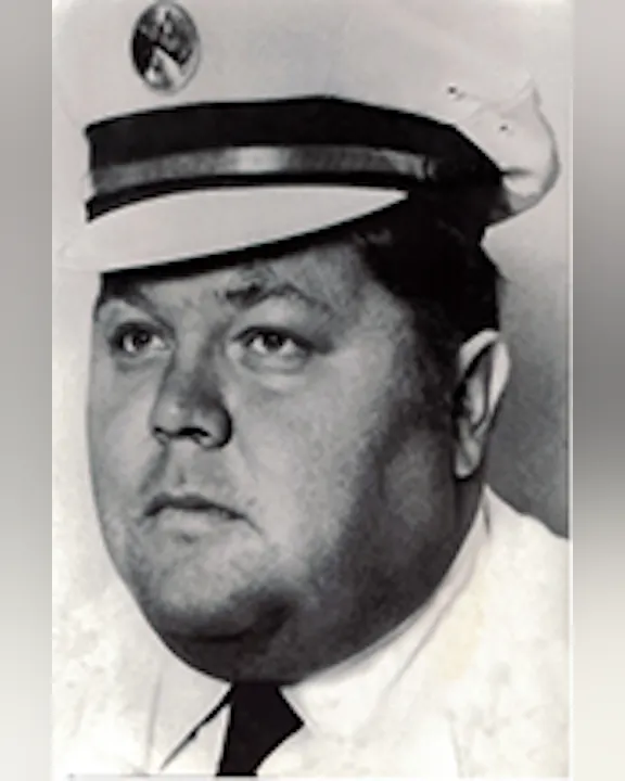 John McKinleyin a uniform and cap, looking to the side. Black and white photo.