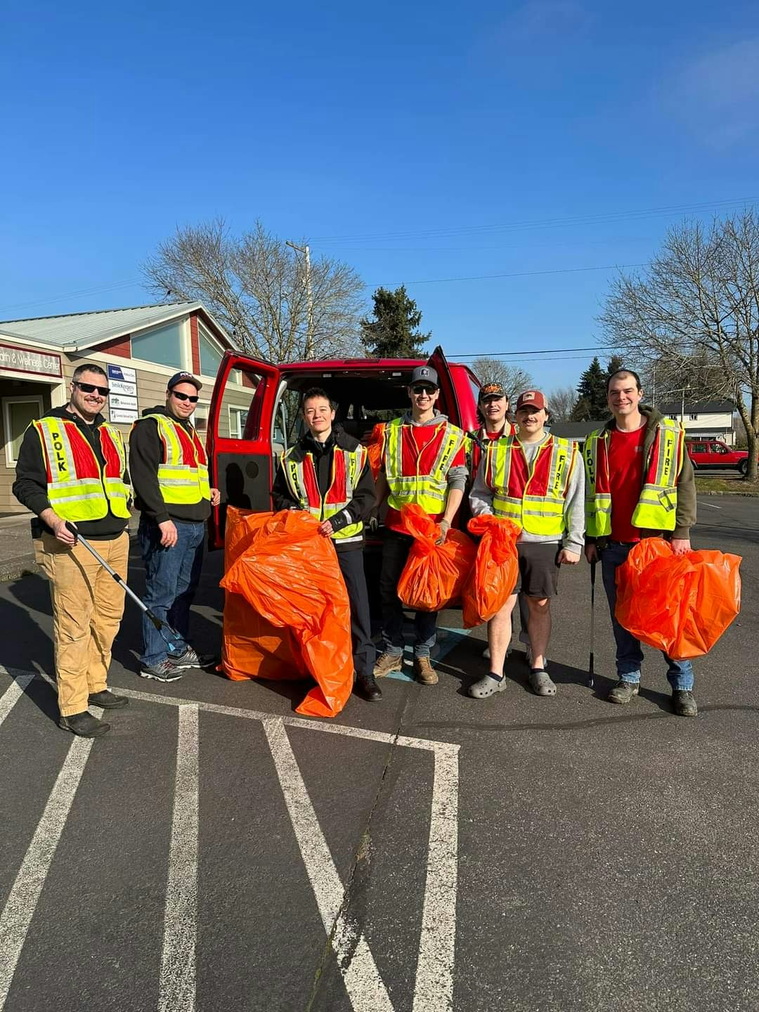 Polk County Fire Volunteers at Road Side Cleanup with orange trash bags