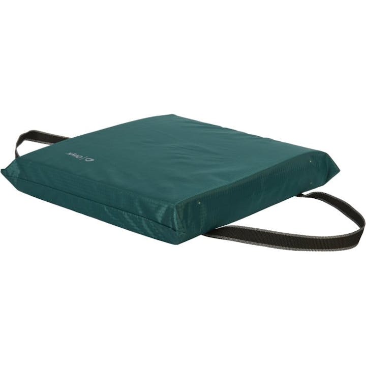 A green cushion with a carrying strap.