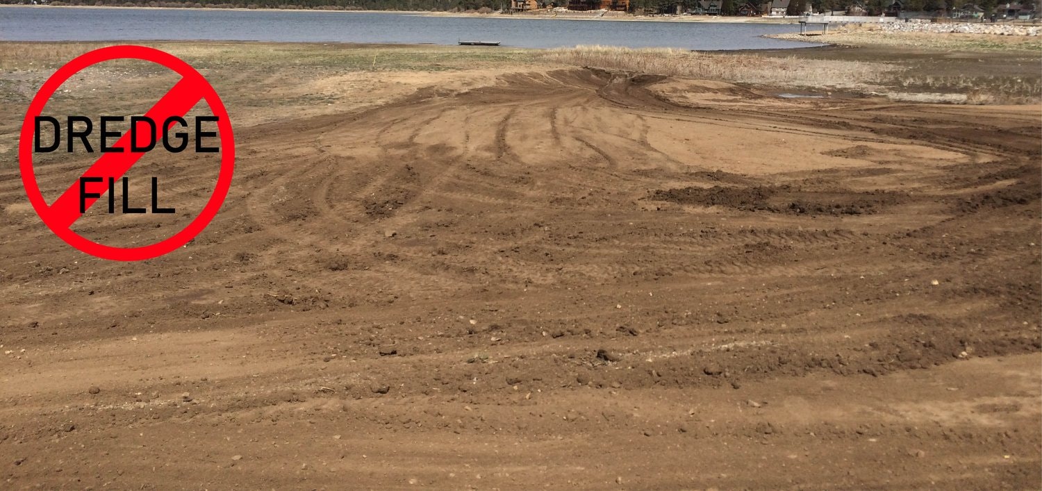 A lakeside area with tire tracks on the ground and a "No Dredge Fill" sign overlaid.