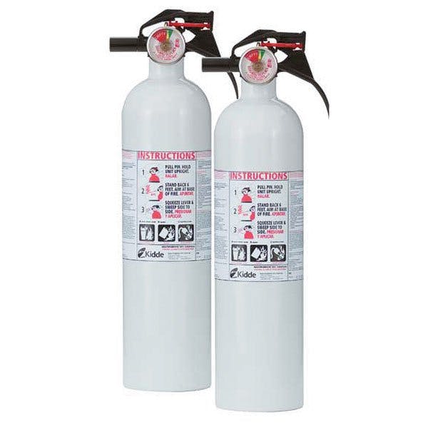 Two fire extinguishers with instruction labels.