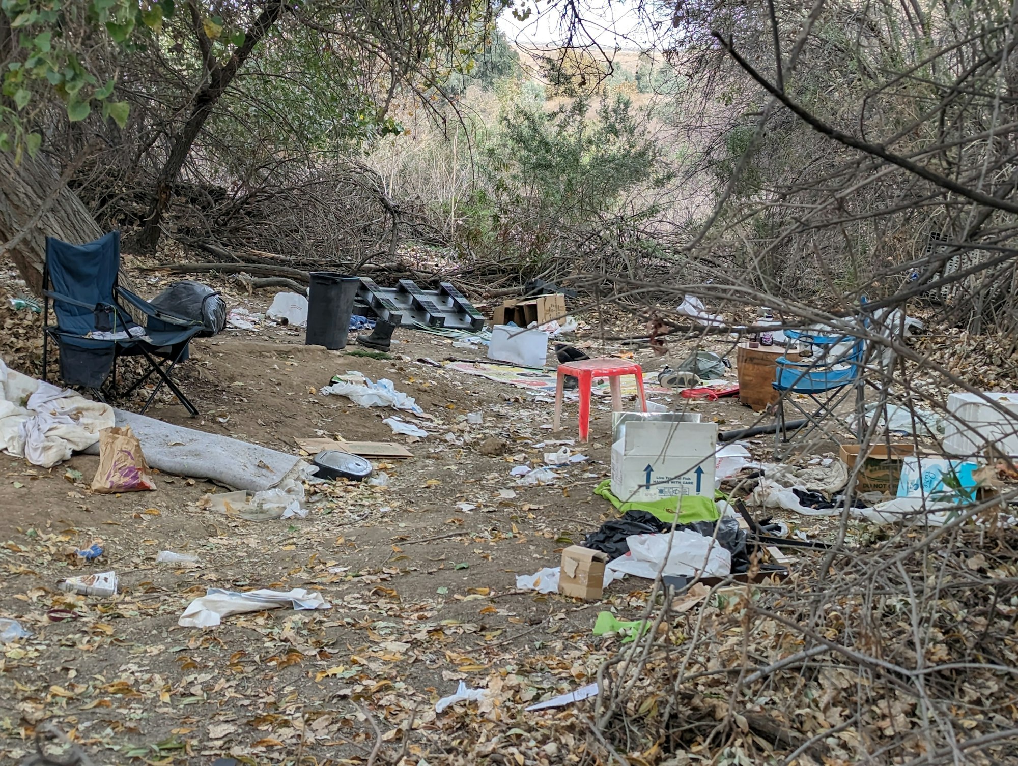 Trash left at an abandoned homeless camp