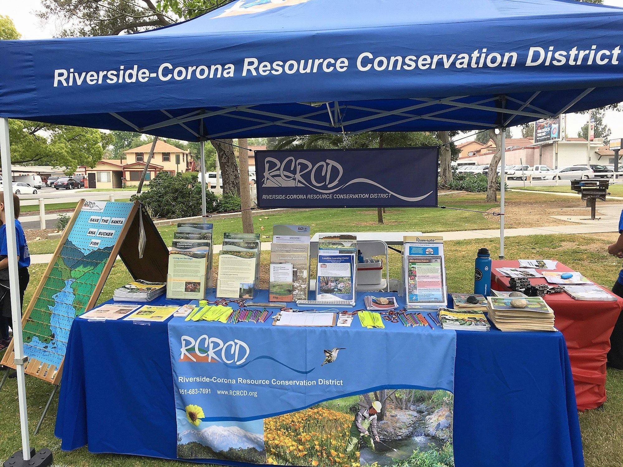 May contain: Table display of RCRCD booth at an outreach event.