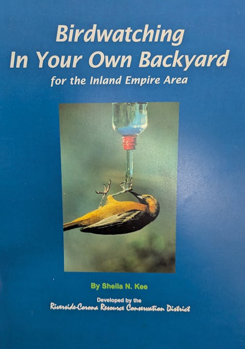 A birdwatching guide cover featuring a bird drinking from a feeder, titled "Birdwatching In Your Own Backyard" by Sheila N. Kee.