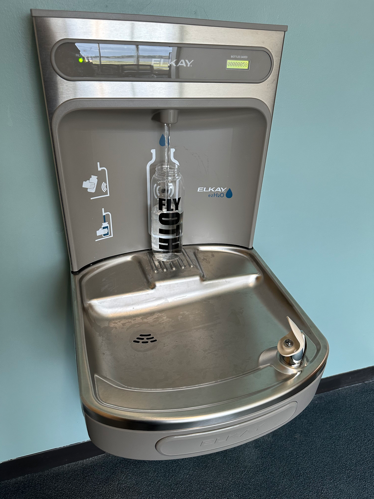 A water fountain with a bottle filling station.