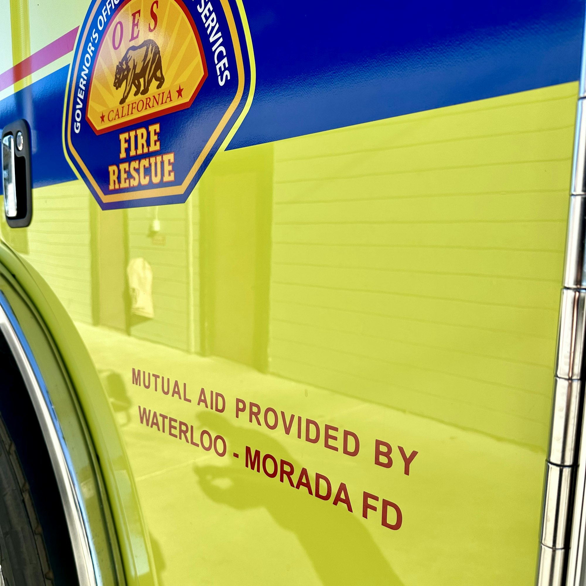 A California fire rescue vehicle with reflective text indicating mutual aid from Waterloo-Morada FD.