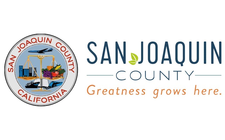 San Joaquin County, California seal with fruits, bridge, airplane and a slogan: "Greatness grows here."