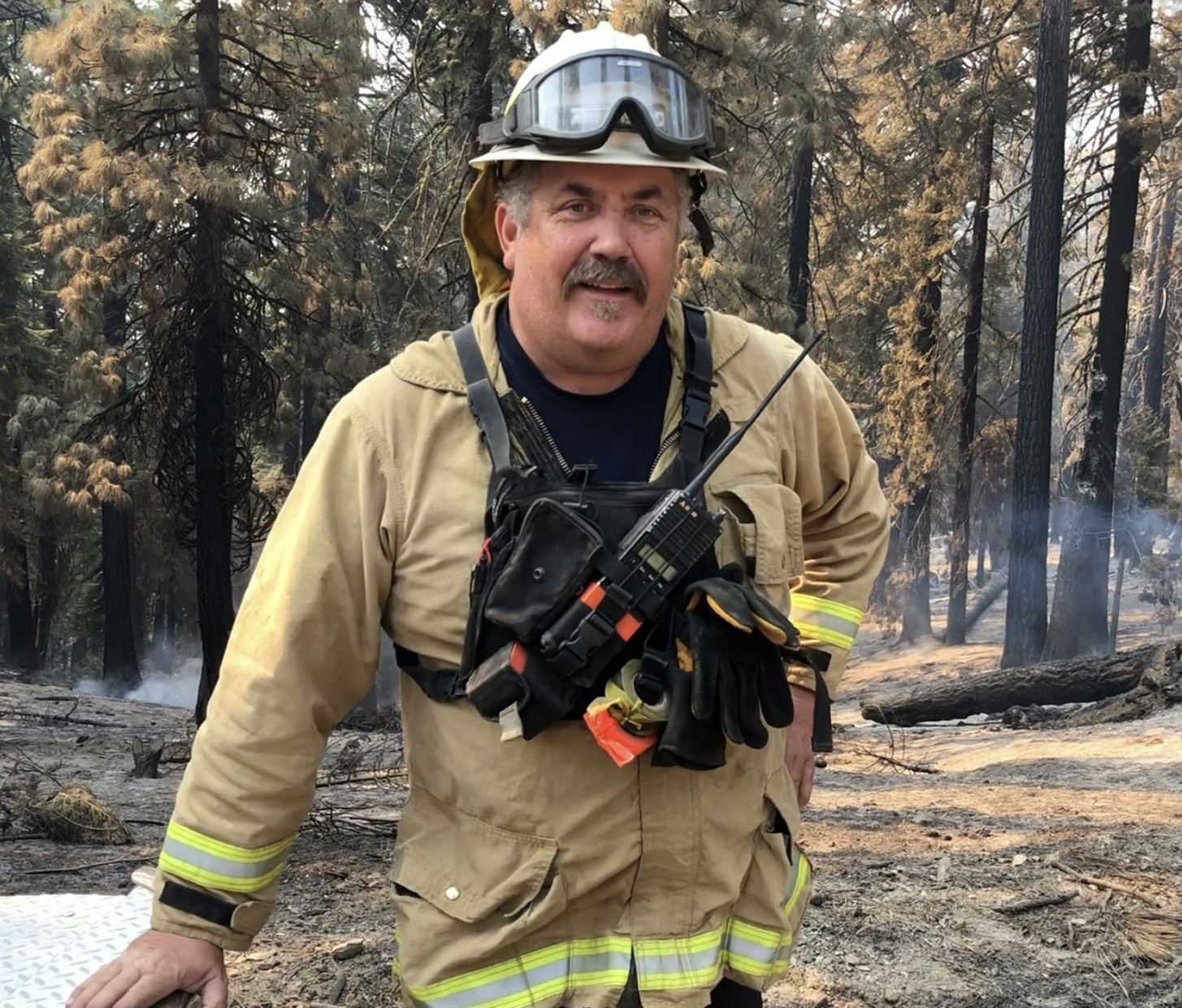 May contain: fireman, person, human, helmet, clothing, and apparel
