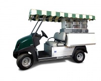 A golf cart with a striped canopy and a built-in drink or snack vending station in the back.