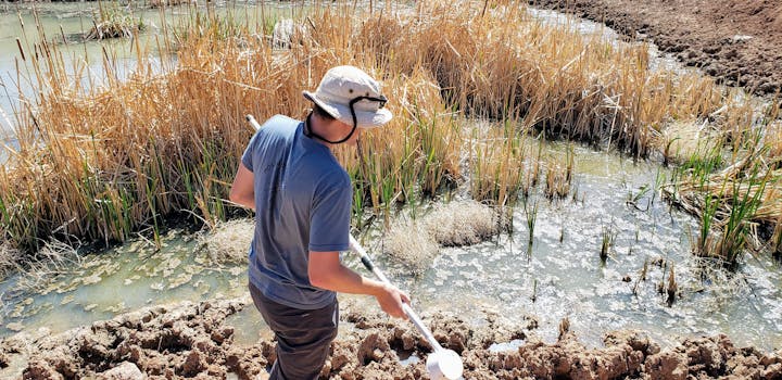 May contain: land, outdoors, nature, person, human, water, clothing, and apparel