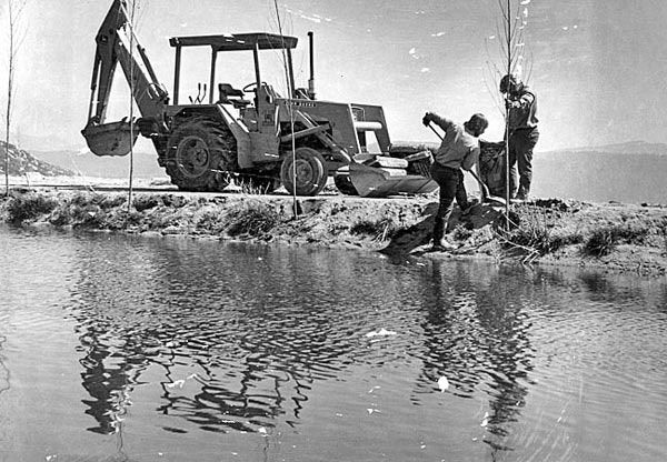 May contain: human, person, water, outdoors, transportation, tractor, vehicle, and bulldozer