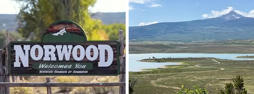 A sign for Norwood, and a scenic view with a mountain, lake, and greenery.