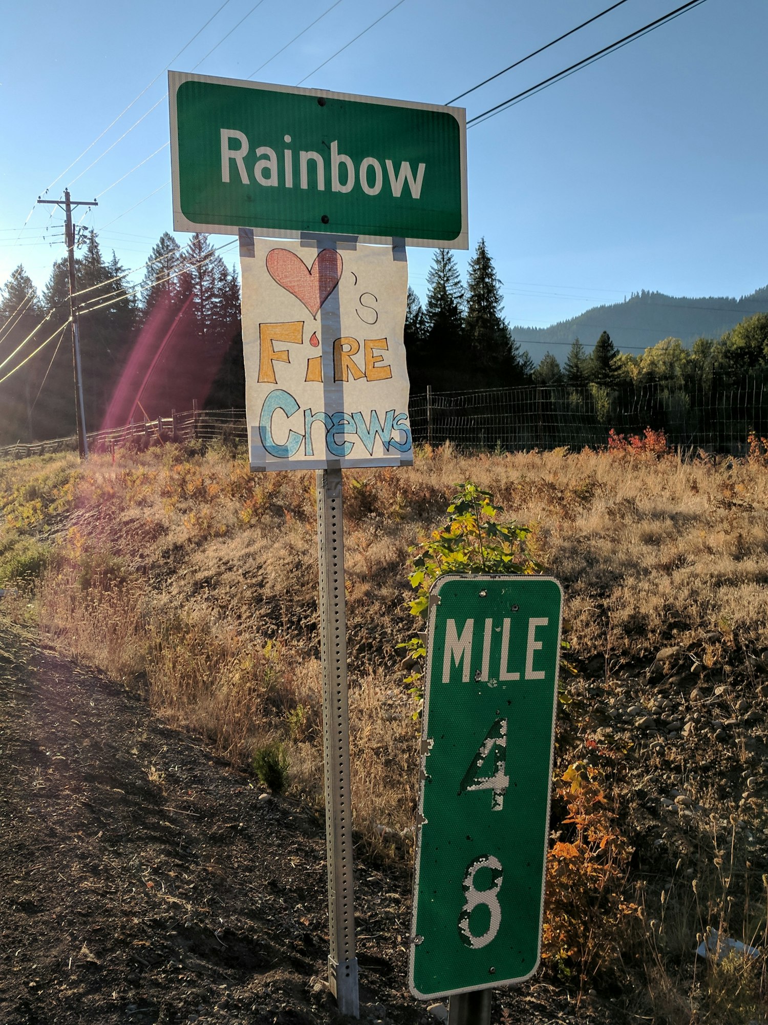 May contain: symbol, road sign, and sign