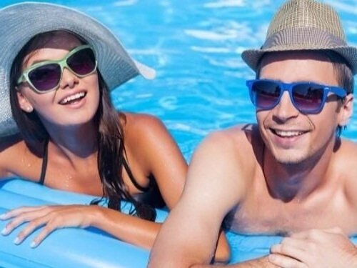 May contain: accessories, sunglasses, clothing, hat, head, person, face, happy, smile, summer, cap, glasses, pool, water, swimwear, photography, portrait, and swimming pool