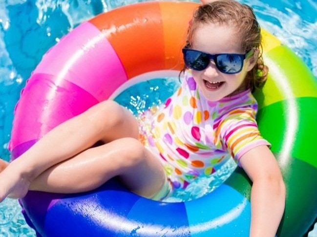 May contain: summer, face, head, person, photography, portrait, accessories, sunglasses, water, leisure activities, sport, swimming, water sports, pool, swimming pool, clothing, lifejacket, vest, and swimwear