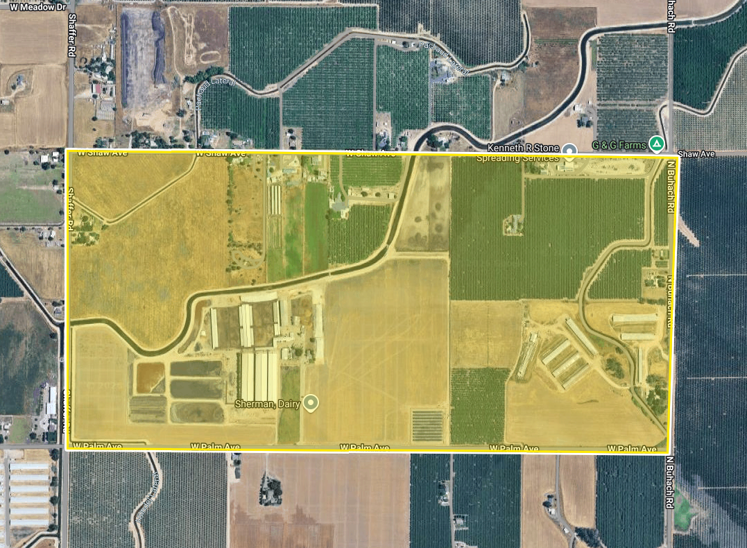 The image shows a satellite view of agricultural land, including a dairy farm and various crops, outlined in yellow.
