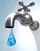 A silver faucet is dripping a blue droplet that contains a small globe, symbolizing water conservation and the Earth.