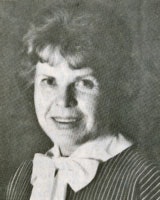Elderly person with a bow tie in a black and white photo.