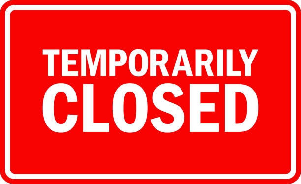 Red sign with "TEMPORARILY CLOSED" in bold white letters.