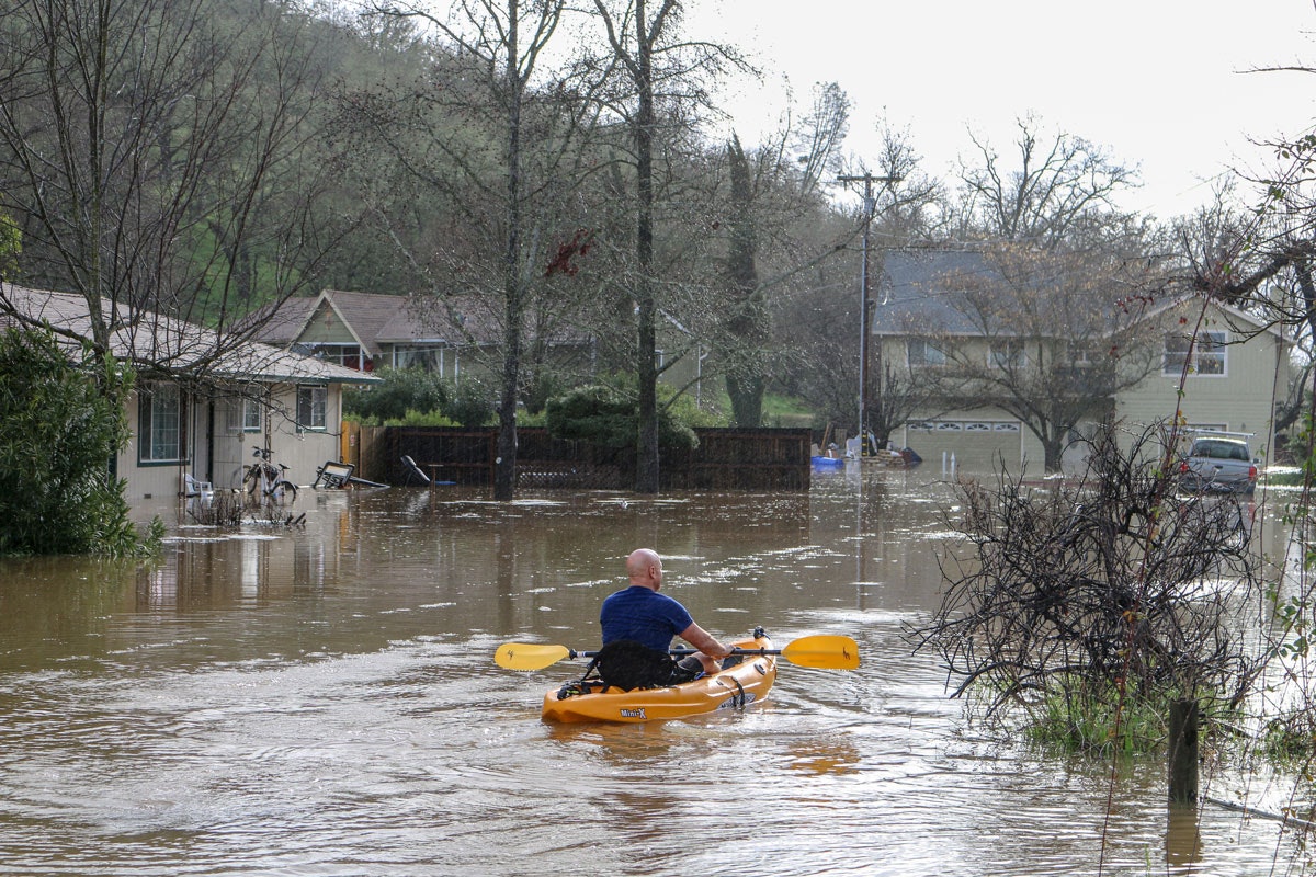 May contain: nature, person, human, flood, vehicle, transportation, automobile, and car