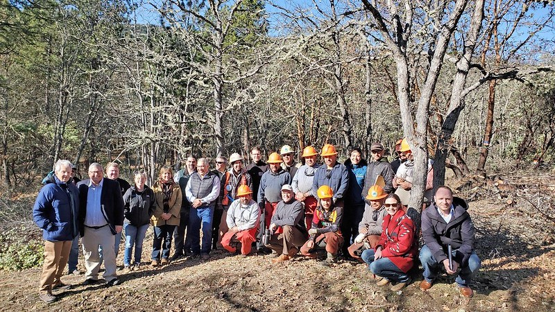 May contain: people, person, plant, vegetation, helmet, clothing, glove, land, nature, outdoors, tree, woodland, wilderness, adult, male, man, groupshot, footwear, shoe, adventure, hiking, and leisure activities