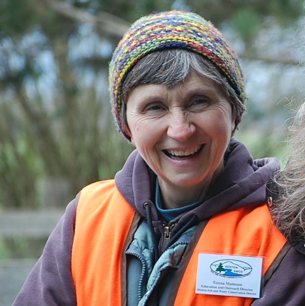 May contain: cap, clothing, hat, coat, jacket, face, head, person, photography, portrait, happy, smile, lifejacket, and vest