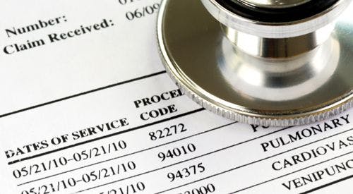 A stethoscope on a medical bill listing service dates, procedure codes, and medical services.