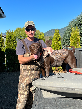 Photo of Todd Hoodenpyl with a brown dog