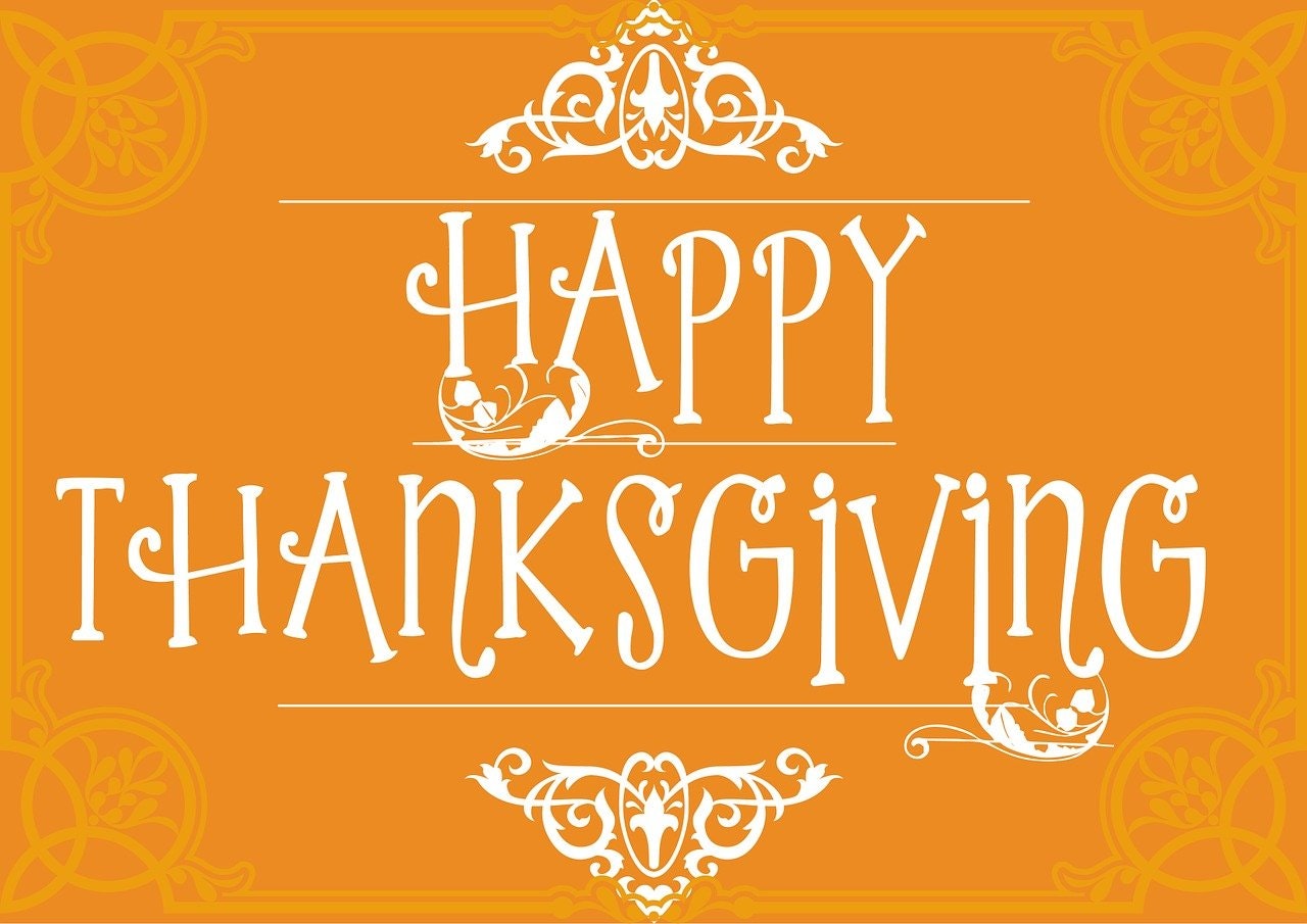 "Happy Thanksgiving" text with decorative elements on an orange background.