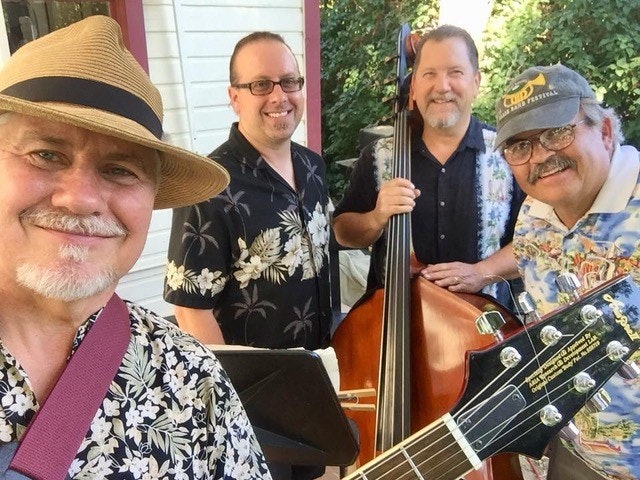 May contain: person, human, hat, clothing, apparel, musician, musical instrument, leisure activities, and guitar