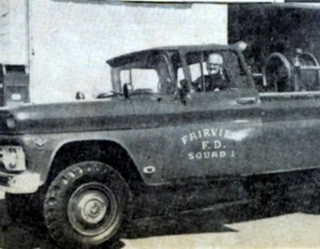 Vintage photo of a Fairview Fire Department vehicle with a person in the driver's seat.