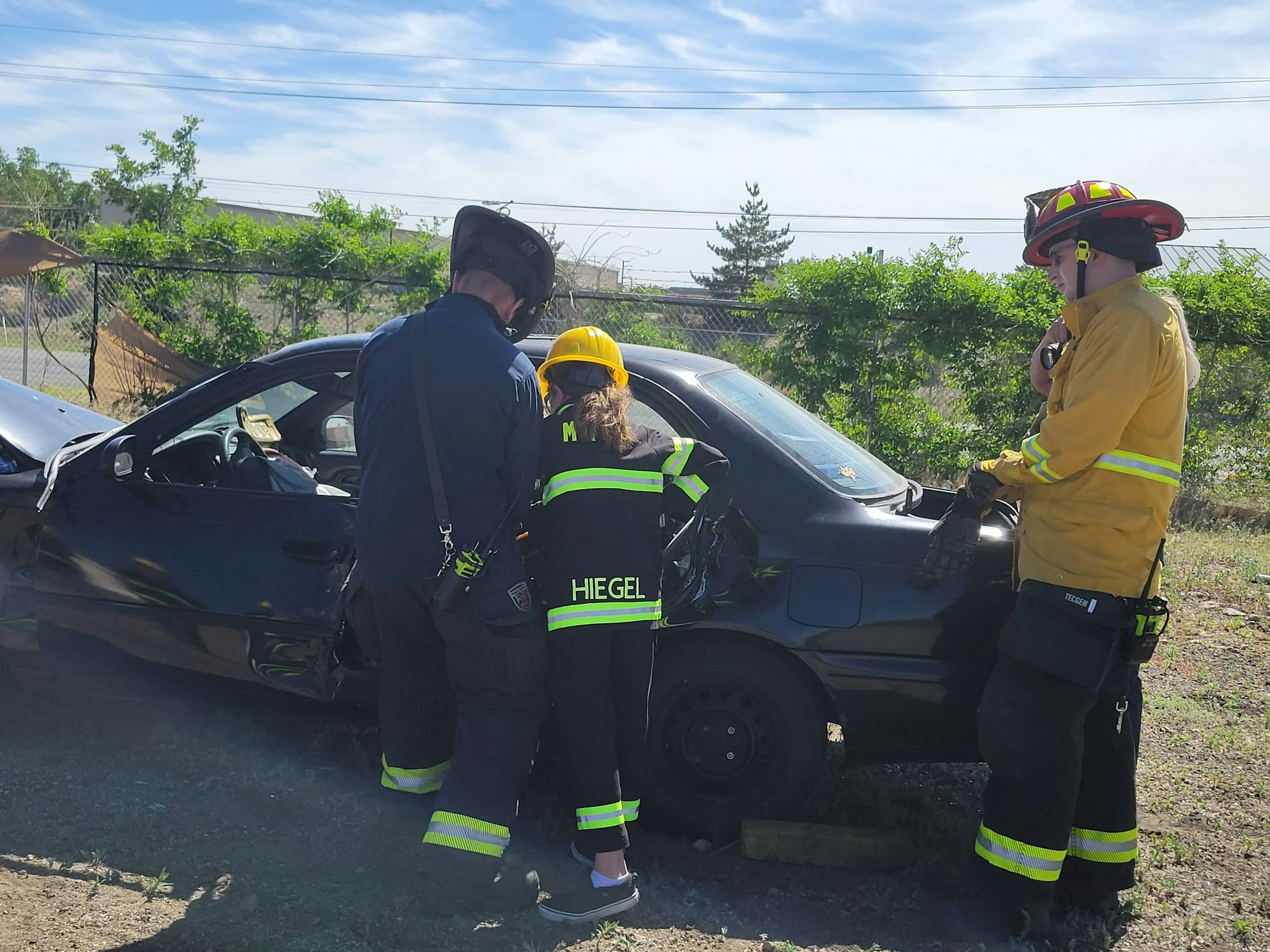 May contain: fireman, person, human, car, transportation, vehicle, and automobile