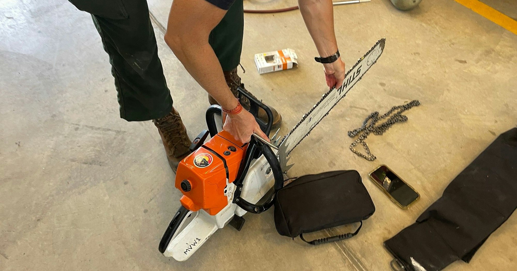 May contain: device, chain saw, tool, e-scooter, transportation, vehicle, electronics, mobile phone, and phone