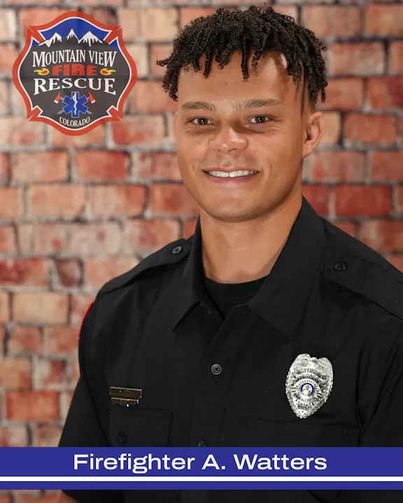 Image of Firefighter A. Watters from Mountain View Fire Rescue, smiling against a brick background with a logo.
