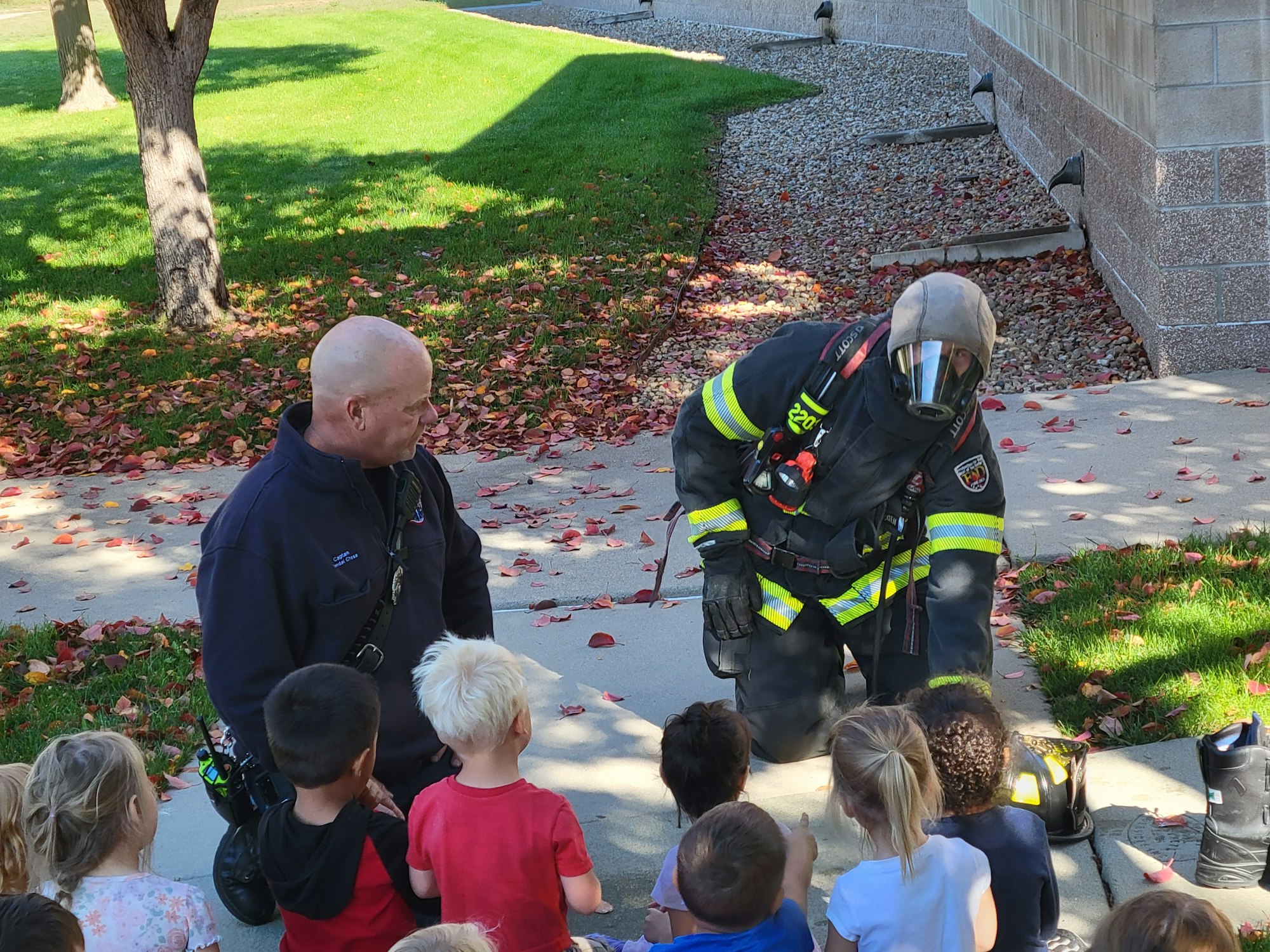 May contain: person, human, fireman, helmet, clothing, and apparel
