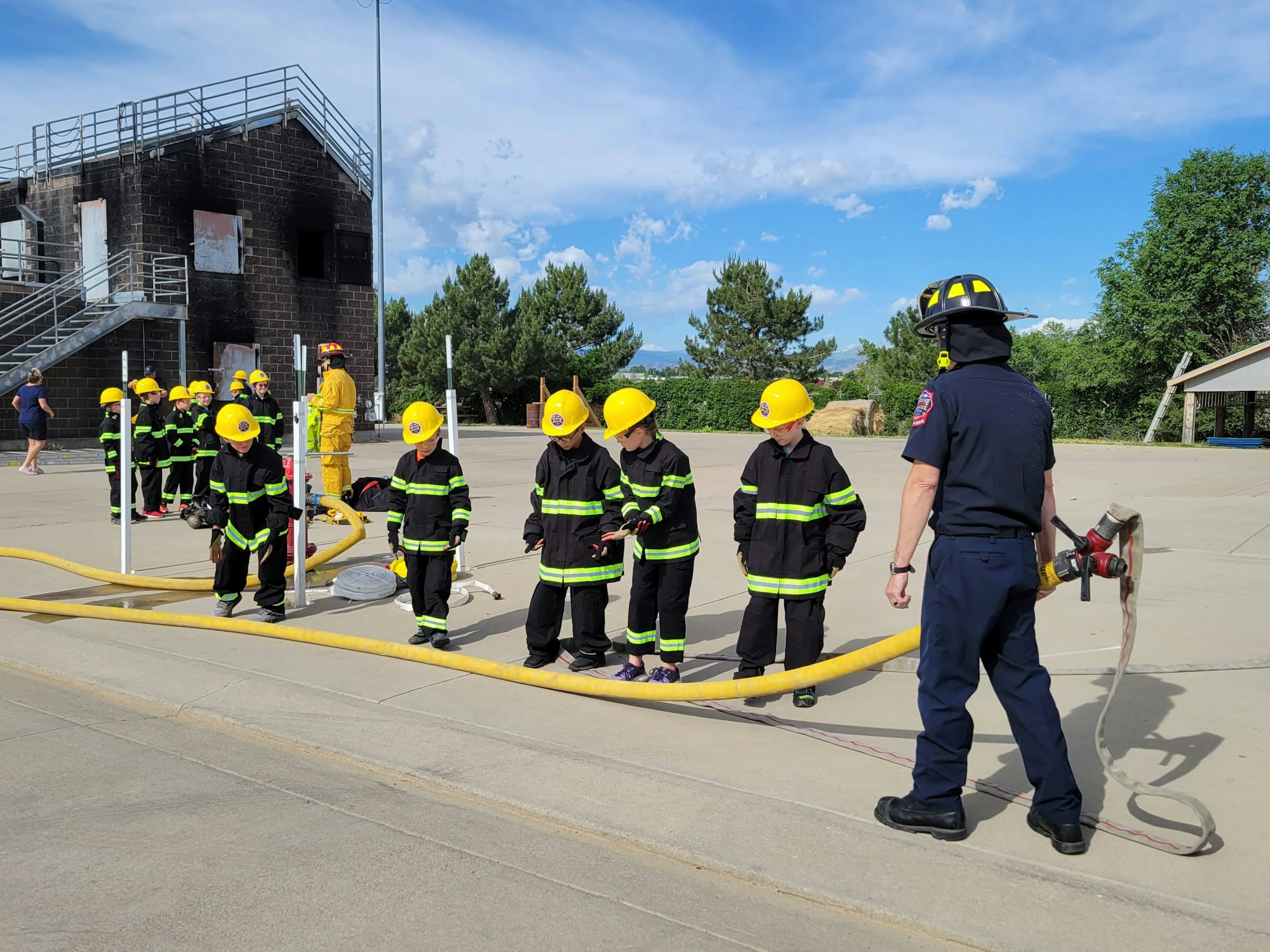 May contain: person, human, fireman, helmet, clothing, and apparel