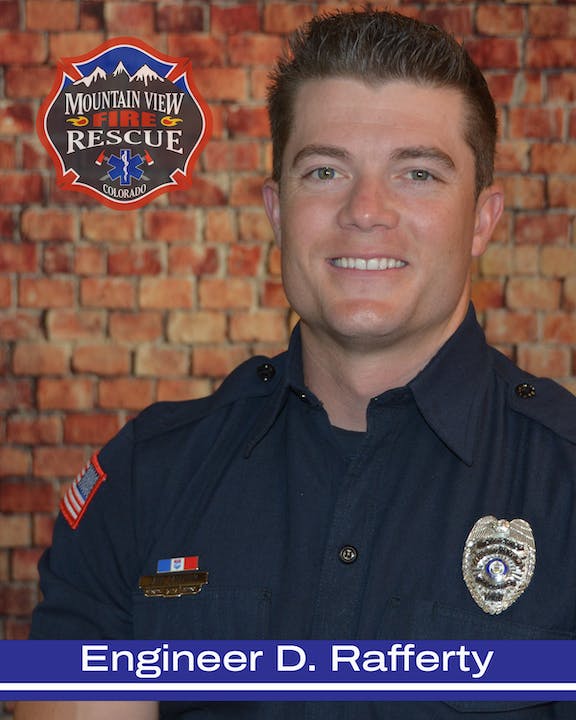 A firefighter with badge, named "Engineer D. Rafferty," from Mountain View Fire Rescue, Colorado, against a brick wall.